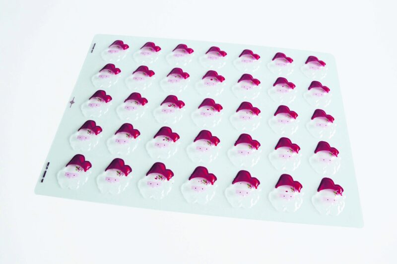 060603 PCB BLISTERS TÊTES DE PÈRE NOËL SOIT 70 EMPREINTES 5X4,6 CM 2PCES ***S/CD***