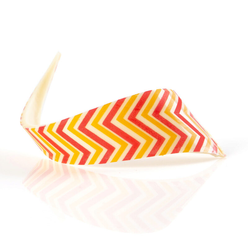 +2069898 BOUCLE  ZIGZAG ROUGE/JAUNE 9CM CHOCOLAT BLANC 69 PCES  ***S/CD***